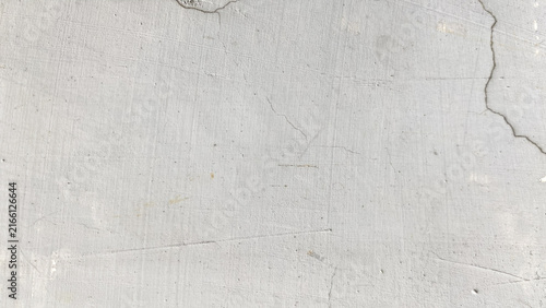 Smooth light grey plaster wall texture with subtle scratches