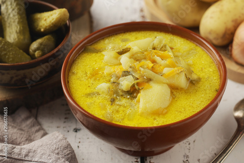 A bowl with traditional soup in Poland Zupa Ogorkowa