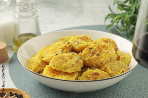 A bowl with traditional Spanish potato dish Patatas a la Importancia