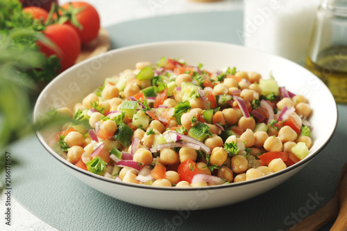 A bowl with traditional Turkish chickpea salad Nohut Salatasi