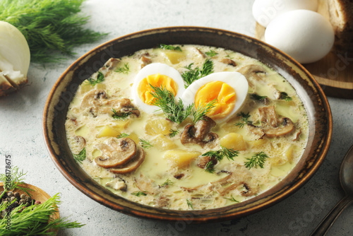 The rustic bowl with traditional Czech mushroom soup Kulajda