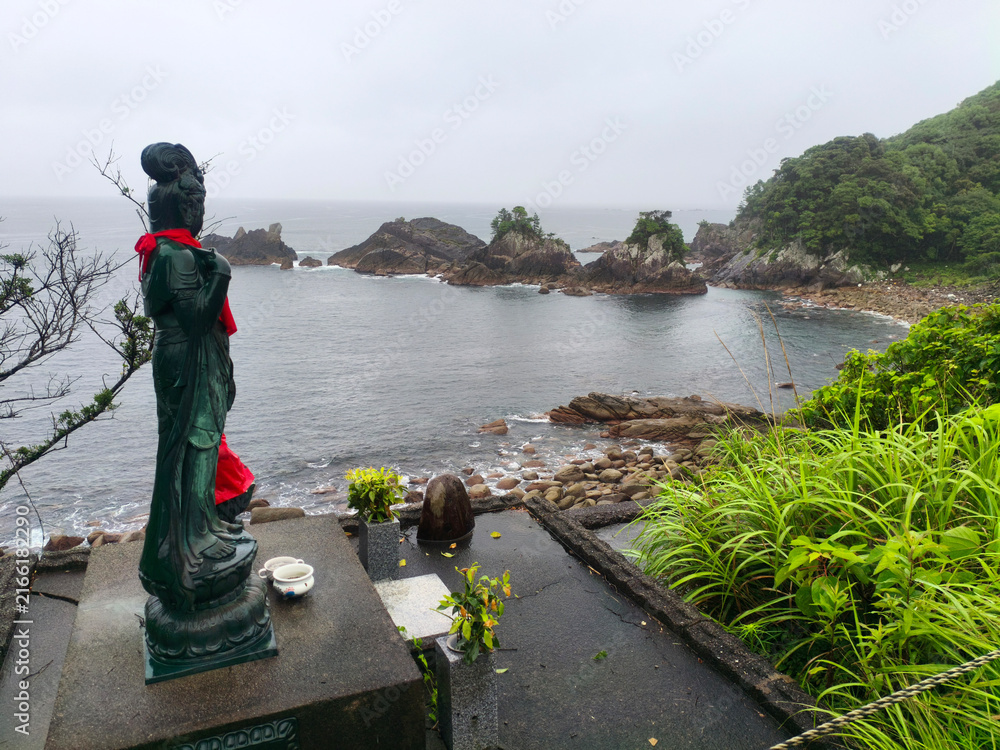 Obraz premium Kannon Bosatsu Statue and Rocky Coastline View in Toyo on Shikoku Henro Pilgrimage Route, Kochi, Japan 2026