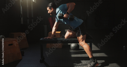 Obraz na plátně Man, exercise or dumbbell row in gym with fitness, wellness or bodybuilding workout for bicep muscle