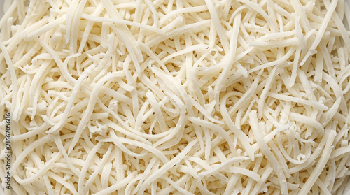 Shredded Mozzarella Cheese Texture Close Up Background for Cooking