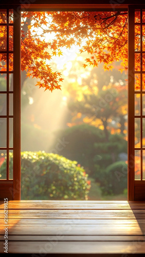 Fototapeta 紅葉の日本庭園が見える和室の縁側 光が差し込む木造建築の廊下と秋の風景 文字入れ可能なコピースペースがある季節の背景素材