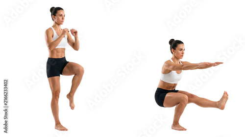 Female athlete performing single leg balance and pistol squat variations in studio fitness setting demonstrating strength, stability and focused training posture