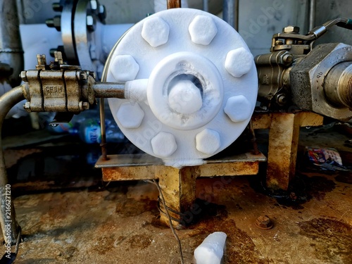 Canvastavla Extreme freezing on industrial pipeline flange covered in thick white ice and co