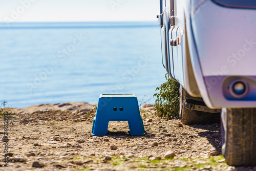 Folding step stool at camper car on camping on sea shore
