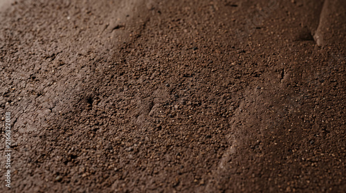 Organic brown clay texture surface. Natural earth background with rough soil pattern.