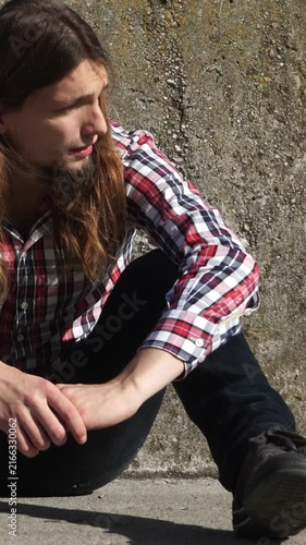 Lonely man depressed and stressed outside. Vertical video