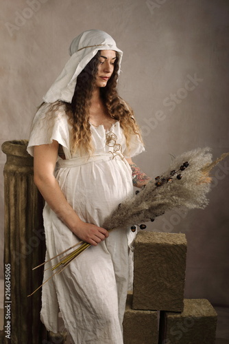 Artistic Full Body Maternity Portrait in Medieval Dress with Unretouched Skin