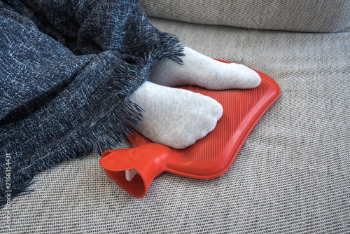 Cuadro en lienzo Hot water bottle, a warm foot warmer for a cold day.