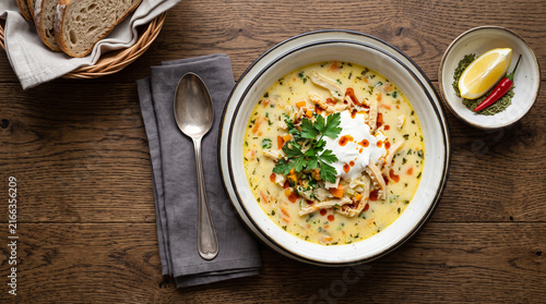 Romanian dish ciorba de burta/ tribe soup on a table seen from above with copy space, ad image traditional romanian food