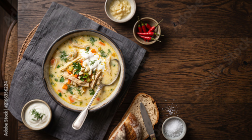 Romanian dish ciorba de burta/ tribe soup on a table seen from above with copy space, ad image traditional romanian food