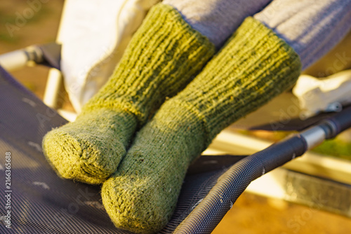 Feet wearing warm wool socks outdoors