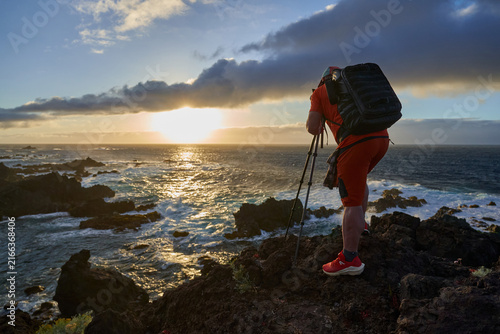 Photographer shooting the coastal sunset