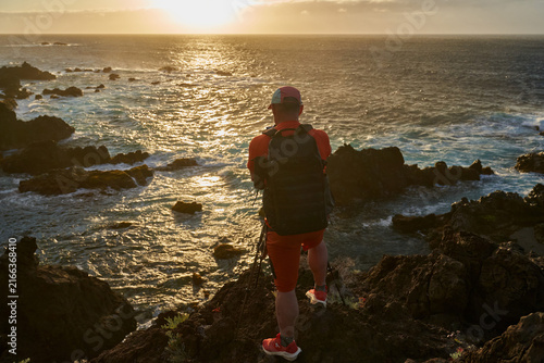 Photographer shooting the coastal sunset