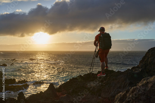 Photographer shooting the coastal sunset
