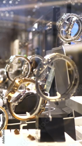 Elegant and expensive wristwatches showcased on stands in a jewelry store display window, featuring a variety of classic and modern designs with precise details for men and women