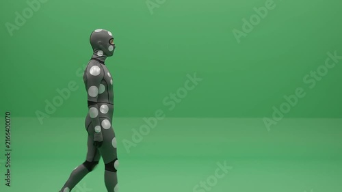 Performer in motion capture suit walking in studio