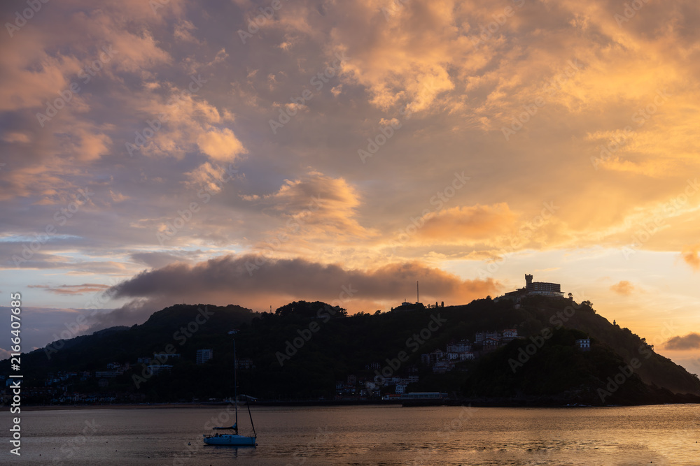 Fototapeta premium Golden Sunset over La Concha Bay and Beach in San Sebastian, Basque Country, Spain