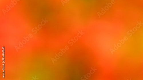 Abstract background image of wildflowers blooming in national parks across Thailand. Features a soft, blurred gradient of orange, yellow, and green. Beautiful blur effect. Nature, forest, flowers, veg