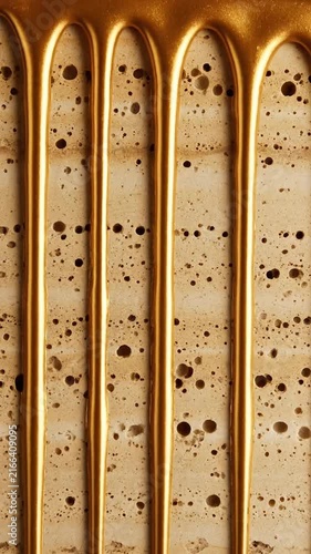 Elegant Gold Paint Dripping Over Textured Beige Travertine Stone Surface Abstract Background