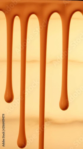 Smooth Creamy Caramel Drip Abstract Background Featuring Flowing Thick Liquid Texture for Culinary Design and Sweet Food Concept
