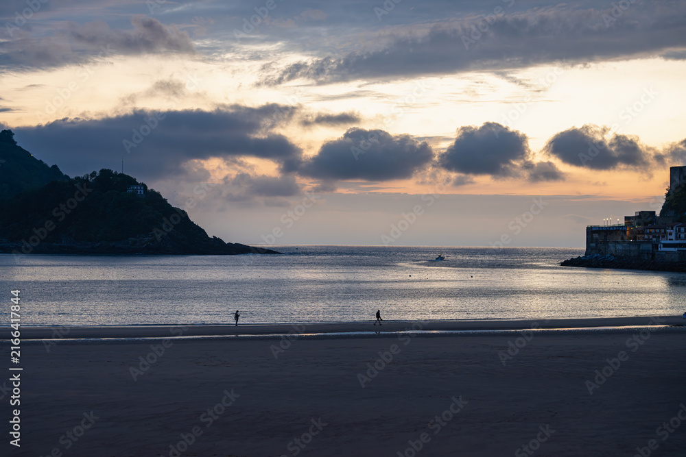 Naklejka premium Golden Sunset over La Concha Bay and Beach in San Sebastian, Basque Country, Spain