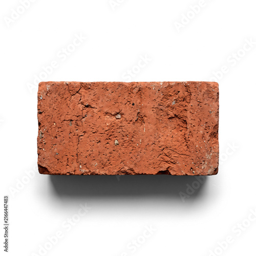 Single red clay brick isolated on white background