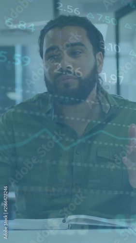 Animation of stock market data over businessman gesturing and explaining in office