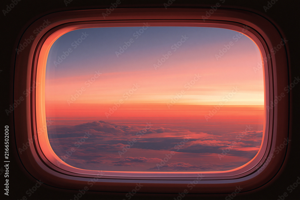 Fototapeta premium Beautiful Sunset Sky and Clouds from Airplane Window