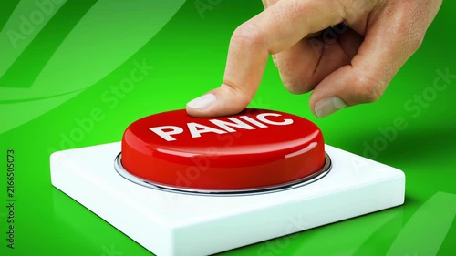 Red panic button being pressed by a finger on a green background symbolizing urgency and emergency