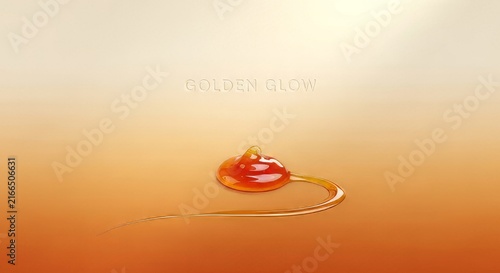 Golden drop of viscous liquid honey or syrup forming elegant curve with text golden glow shimmering light.
