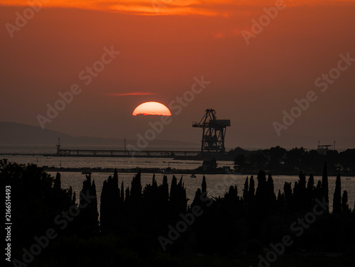 Orange sunset over Ploce harbor and Adriatic coast