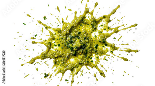 Green herb pesto splash with seasoning bits top view.