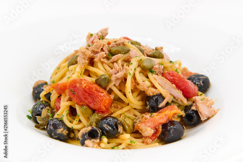 Bild auf Leinwand Spaghetti Pasta with Tuna, Black Olives, Capers, and Tomatoes Isolated on White