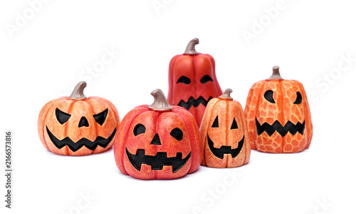 Set of cute orange jack-o'-lantern pumpkins with creepy and scary carved faces isolated on white background for halloween seasonal autumn holiday decoration elements.