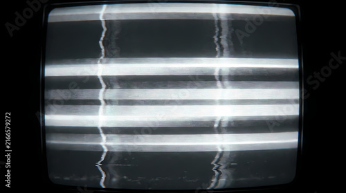 Horizontal white lines with vertical distortions fill an old TV screen.
