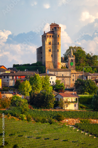 Summer panorama, taken at sunset, of the village of Serralunga d'Alba (Piedmont Region, Italy) with its medieval castle and houses. Is the world famous winery area of Langhe, Unesco site since 2014.