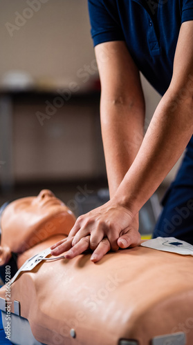Hands performing CPR compressions