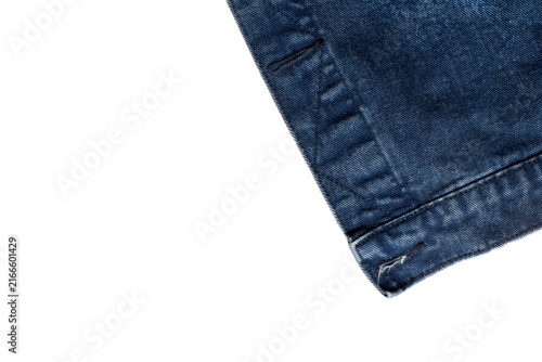 Konstfotografi Dark blue denim jacket hem detail with buttonhole isolated on white background, jeans fabric texture corner layout