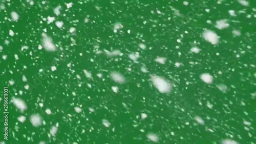 Falling white snow flakes drifting gently down green screen video. flake winter cold weather storm green screen overlay