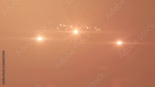 Bright orange lens flare with glowing particles, bokeh effect and soft focus background, abstract light effect for background, intro, motion graphics