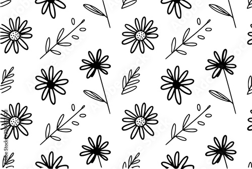 Seamless pattern with hand-drawn black and white flowers and leaves for textile and decorative backgrounds