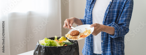 Фотография people put bio trash from food waste in domestic homes to compost bins to make fertilizer to reduce global environmental pollution