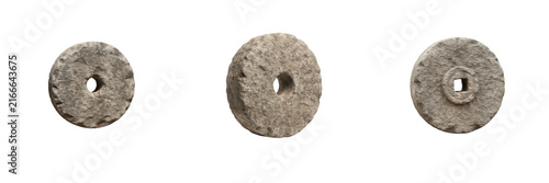 Canvas Print Set of antique stone millstones or grinding wheels with central axle holes isola