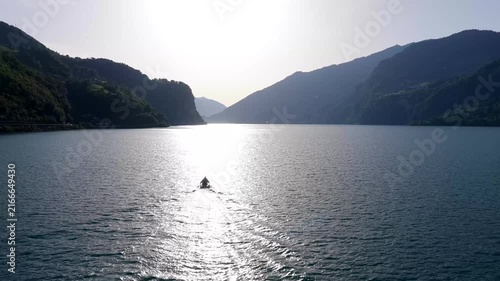 Aerial Drone View of Sailboat Racing Across a Mountain Lake