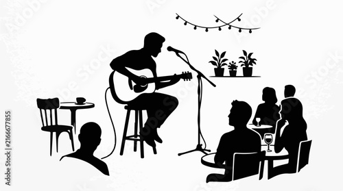 Musician playing acoustic guitar for an audience in a cafe