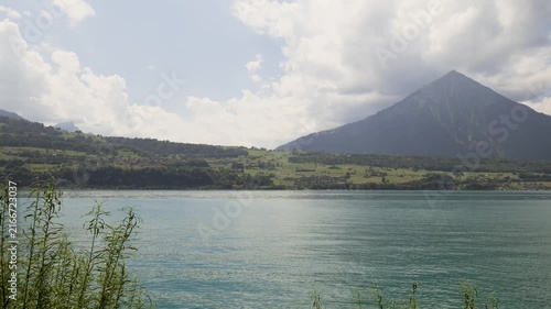 Stunning view of the turquoise waters of lake thun with the niesen mountain in the background. Switzerland